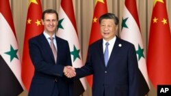 ستمبر 22, 2023 کو چین کے صدر شی کے ساتھ شام کے صدر بشار الاسد۔